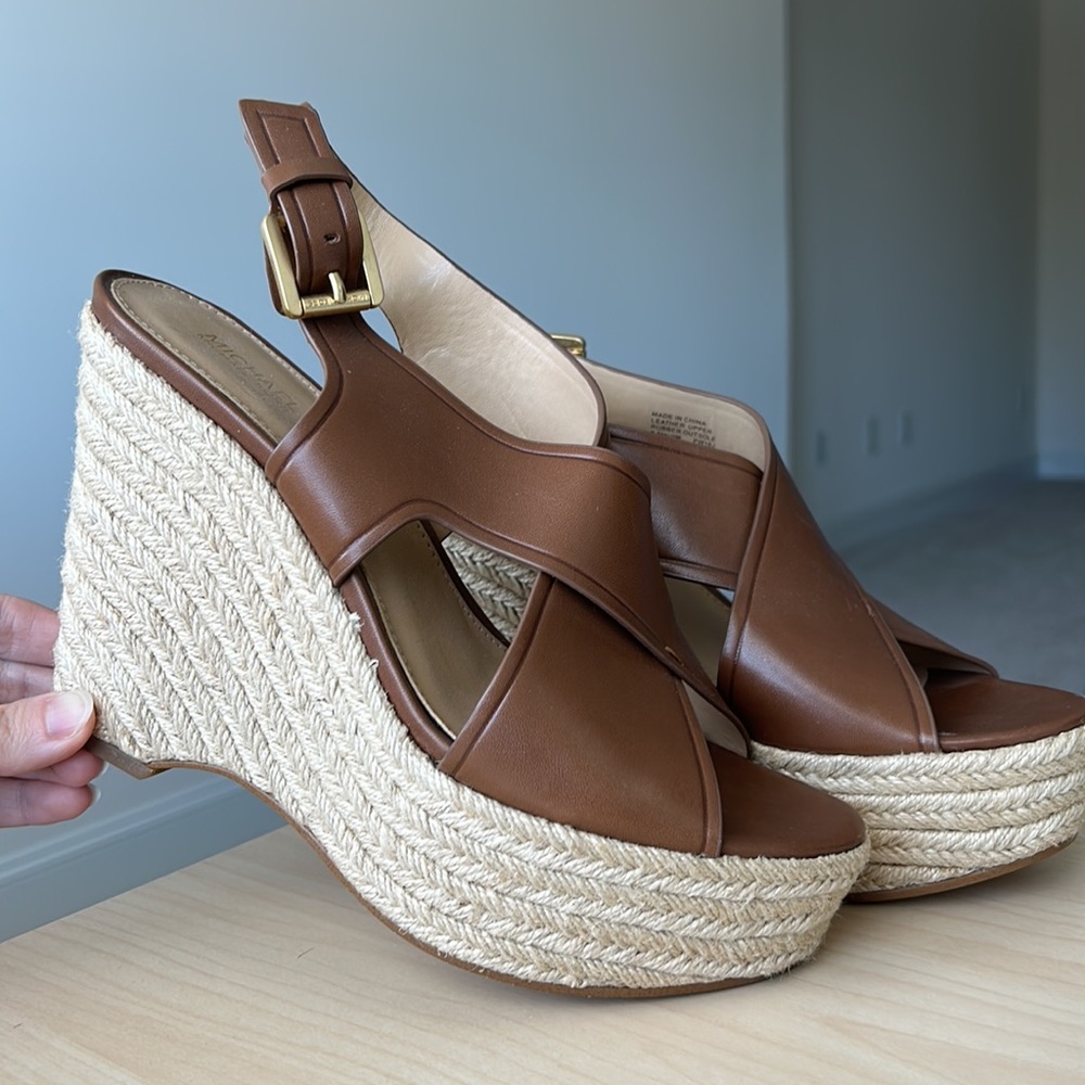 Michael Kors brown leather wedge with platform. Woven espadrille bottom.